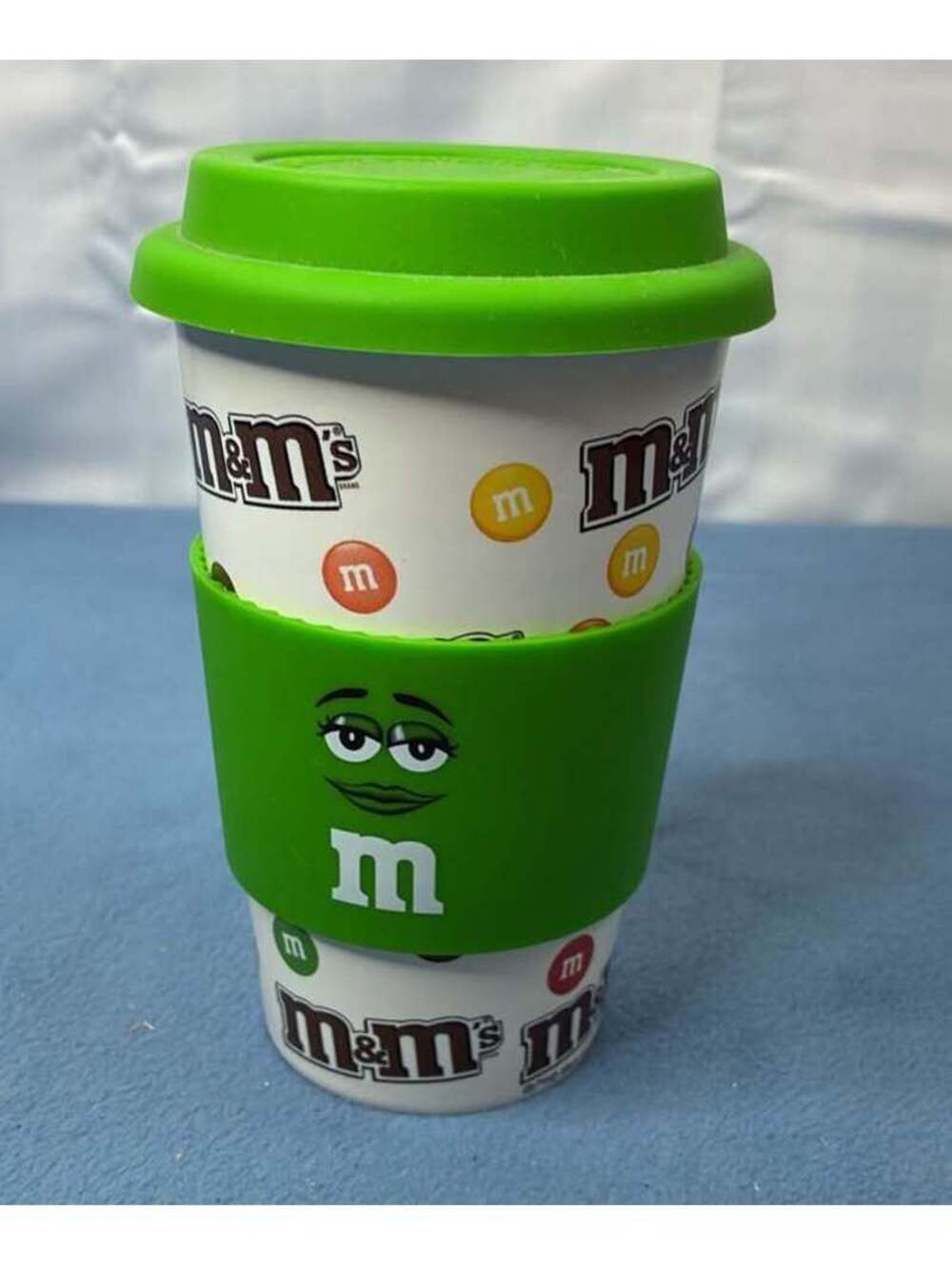 M&M's Green Character Ceramic Travel Mug with Silicone Lid and Sleeve